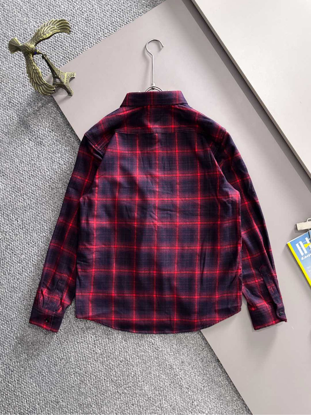 Long-sleeve plaid shirt back view on hanger, red and dark blue check