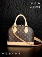 Louis Vuitton monogram handbag with beige base trim and red striped shoulder strap