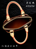 Louis Vuitton mini bag with gold zipper, red striped strap, and top handle
