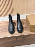 Black leather Chelsea boots with check elastic side panel and chunky rubber sole