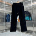 Dark denim pants with belt loops, front pockets, and button closure