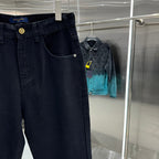 Dark denim pants on hanger with front pocket curve and button closure