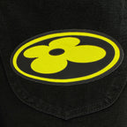 Yellow and black logo patch on dark denim fabric