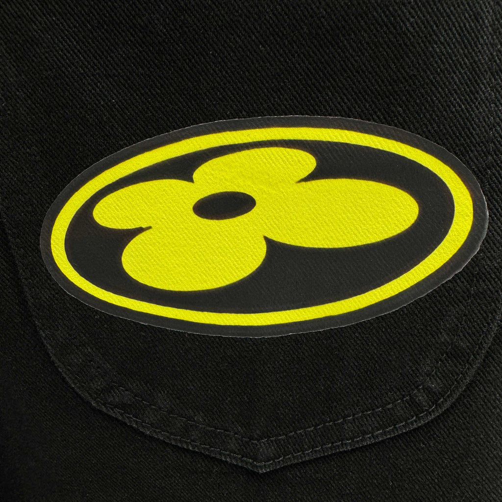Dark blue denim patch with yellow smiling emblem appliqué