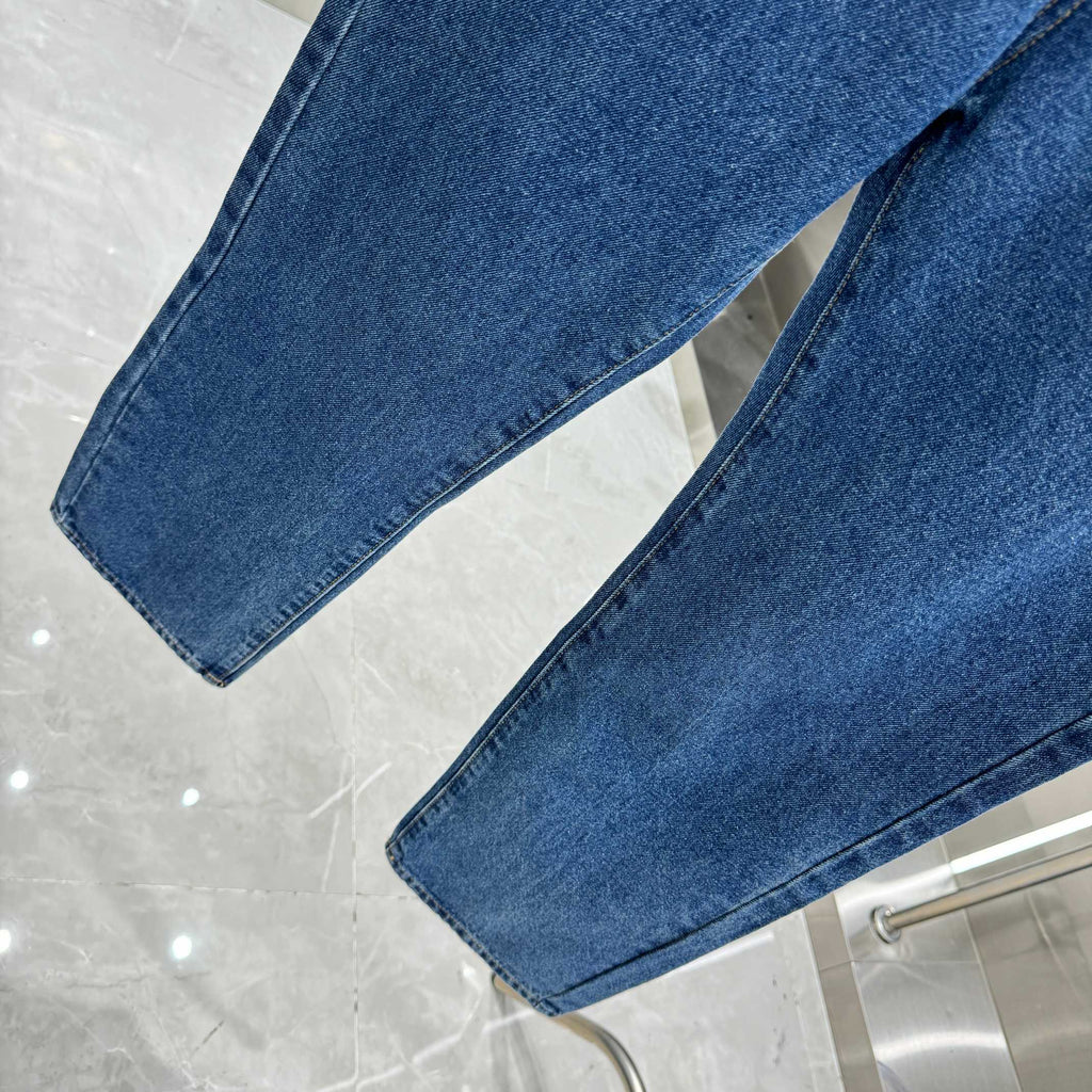Blue denim Louis Vuitton pants hem detail, straight-leg cuffed bottoms