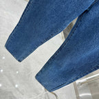 Blue denim Louis Vuitton pants hem detail, straight-leg cuffed bottoms