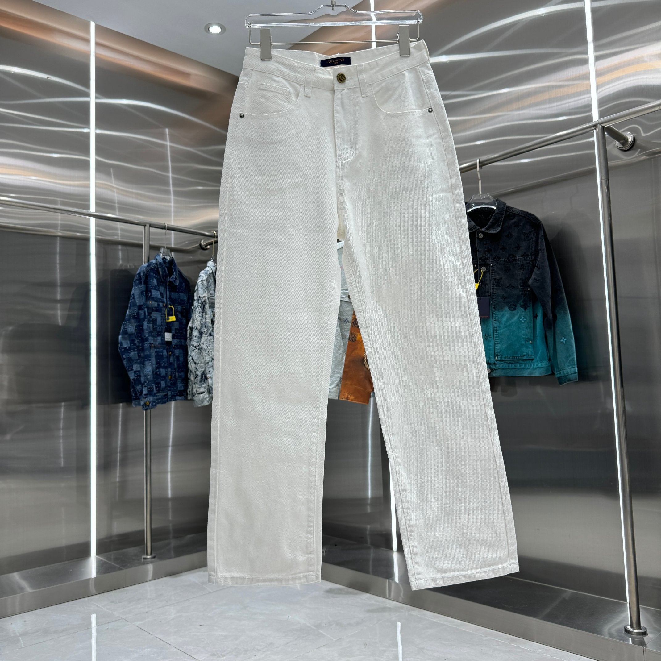White denim pants with belt loops, button closure, and front pockets