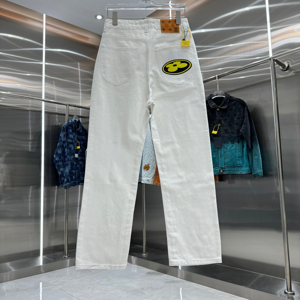 White denim pants with a large round logo patch on the thigh