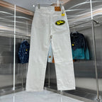 White denim pants with a large round logo patch on the thigh