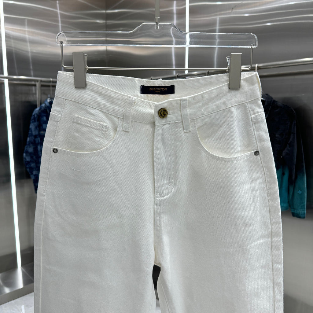White denim pants with belt loops, two front pockets, and button fly