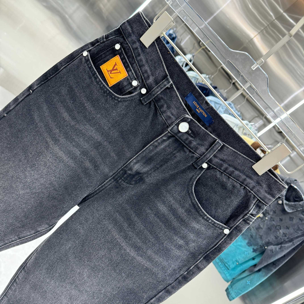 Dark denim jeans waistband patch with metal buttons and belt loops