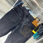 Dark denim jeans with front coin pocket and yellow emblem stitching
