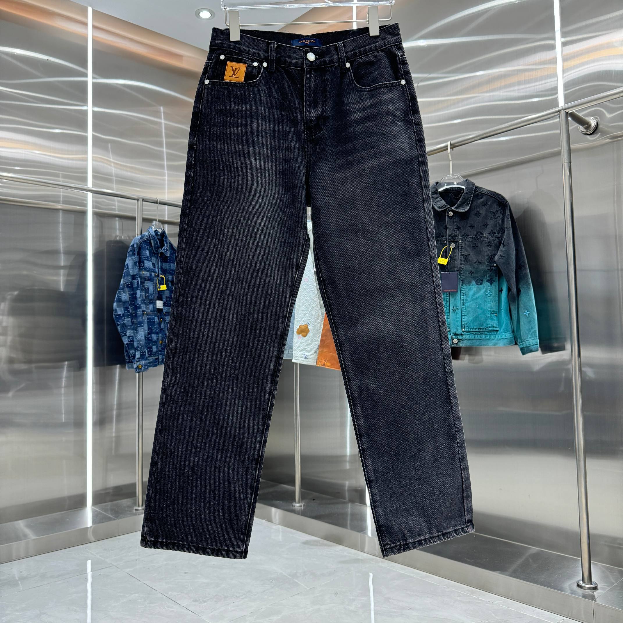 Dark denim jeans with button waistband and front pockets