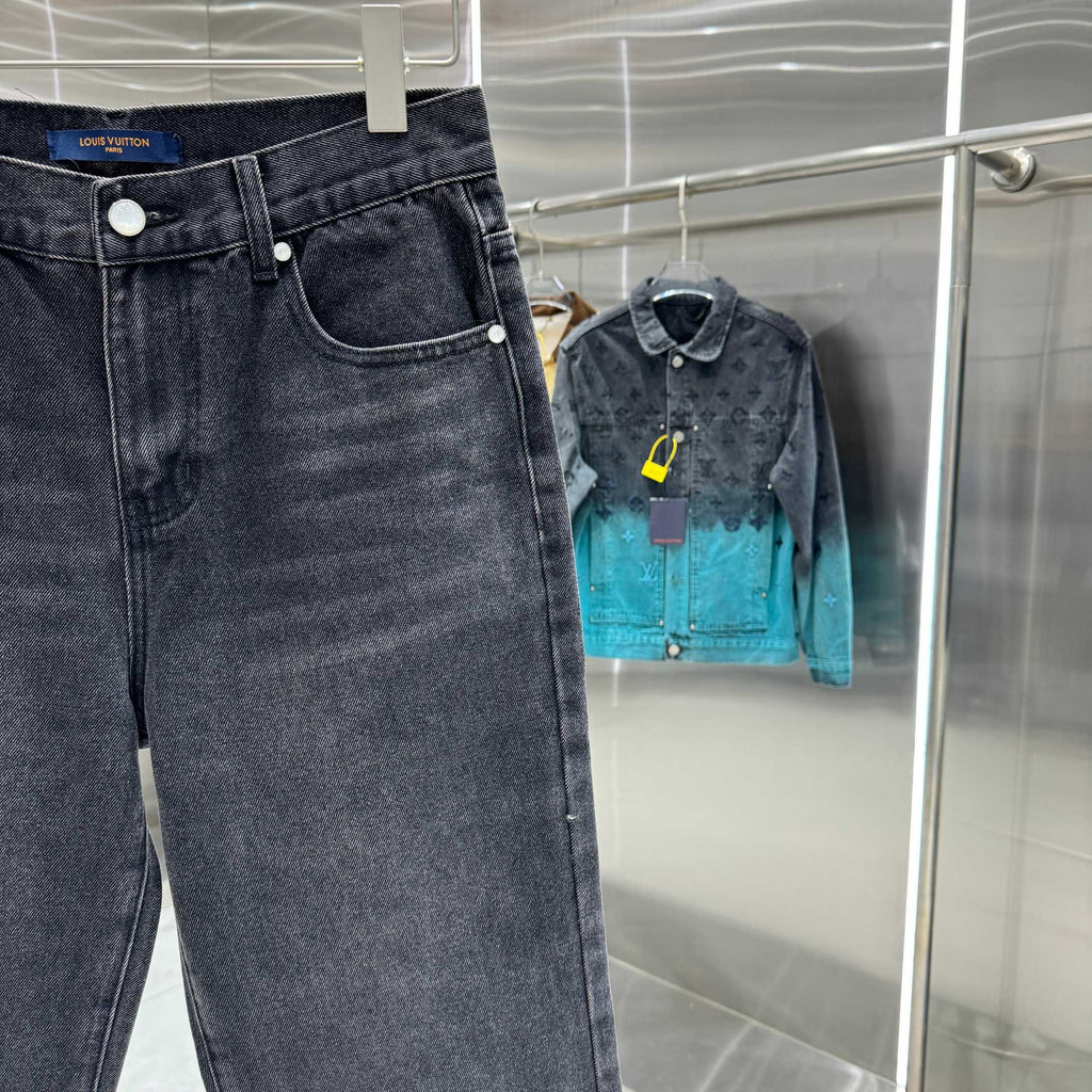 Dark denim jeans on hanger with front pocket and button closure