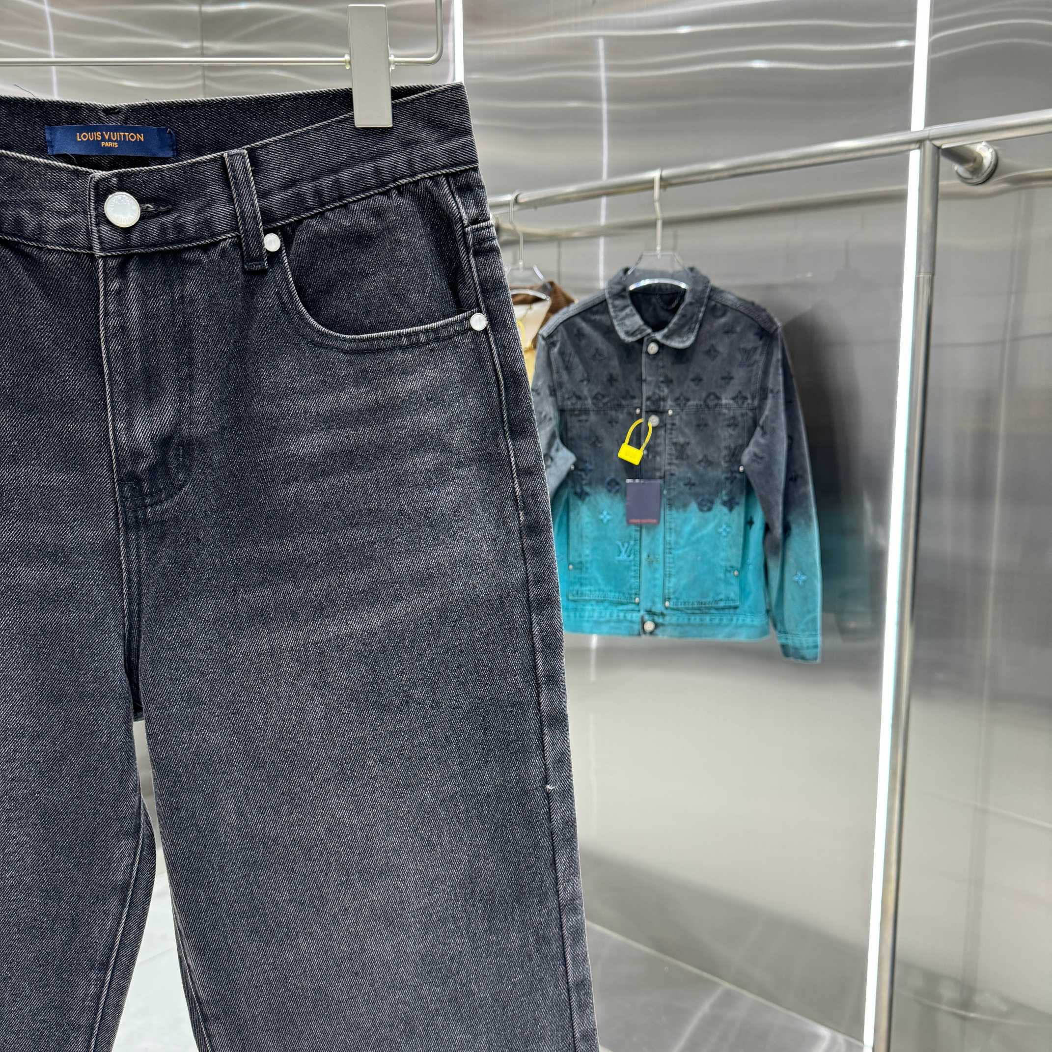 Dark denim jeans on hanger with front pocket and button closure