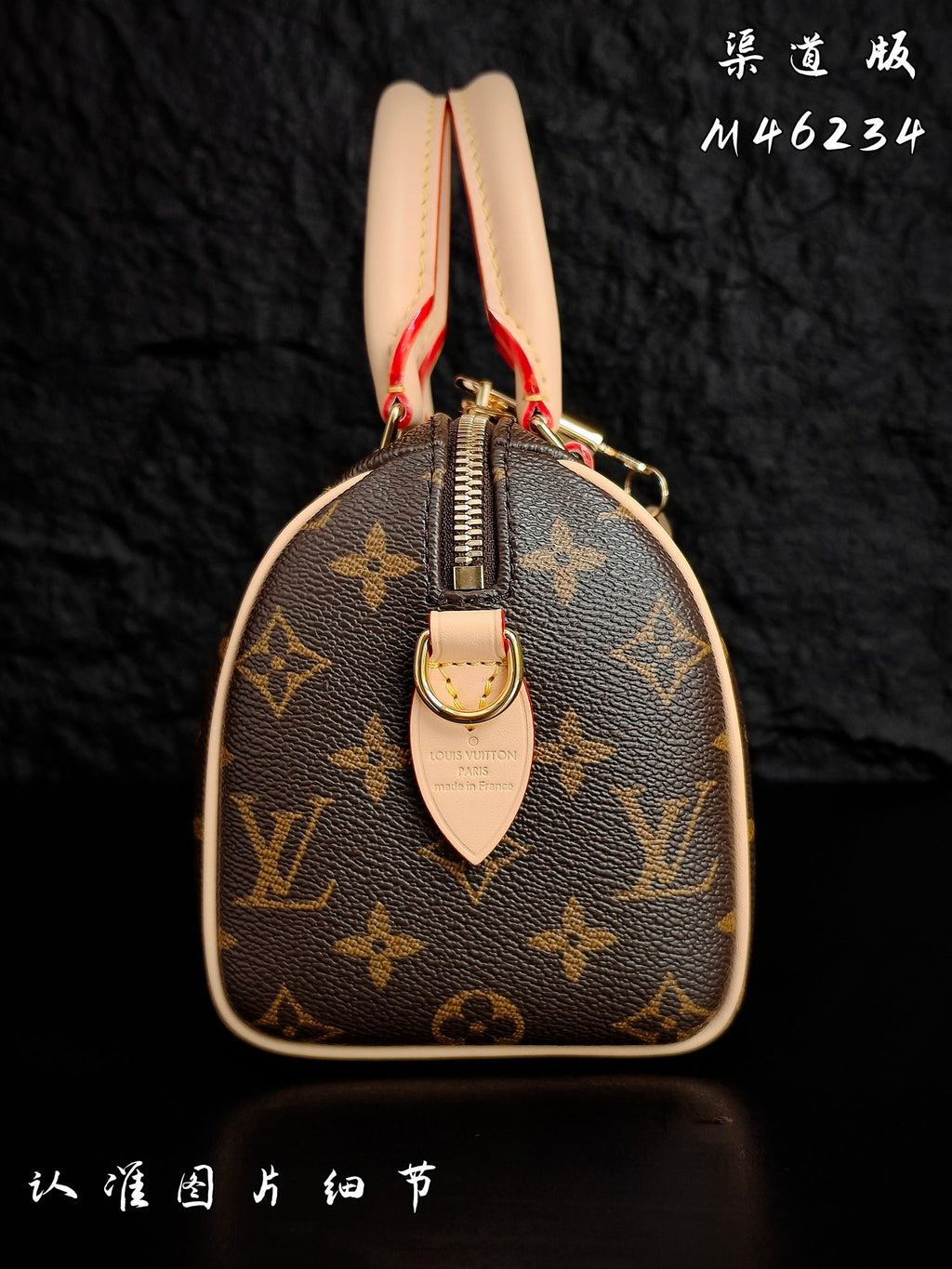 Louis Vuitton monogram top view with zipper track and tan leather pull tab