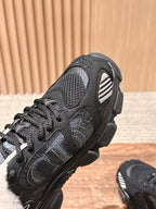Black unisex sneaker upper close-up with mesh panels and lace fastening