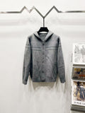Grey long-sleeve hooded zip jacket with Dior-style logo panels and ribbed cuffs