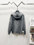 Back view grey hooded zip jacket with repeating Dior-style pattern stripe across shoulders