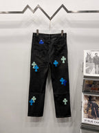 Black denim pants with blue and light-green patch designs, rear view