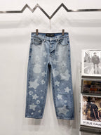 Light blue denim pants with star and heart print, five-pocket style and belt loops