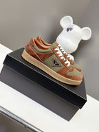Unisex low-top sneakers in brown and olive with white laces and side patch detail