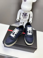 Prada unisex suede sneakers, navy with white laces and triangular logo on side