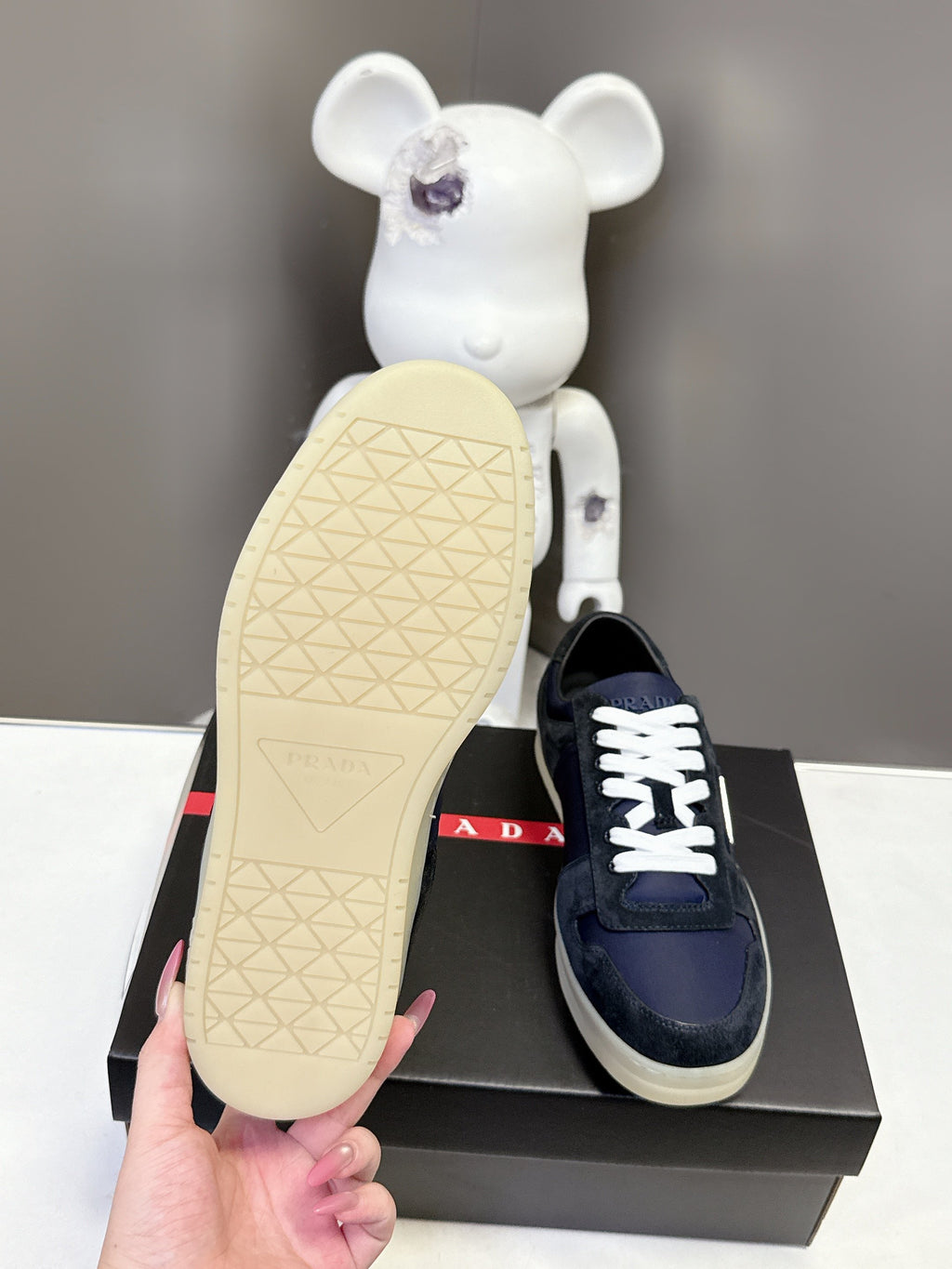 Prada unisex sneaker outsole, cream tread with navy upper and white laces