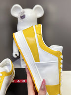 Prada unisex sneakers profile, white sidewall and yellow heel panel with thick sole