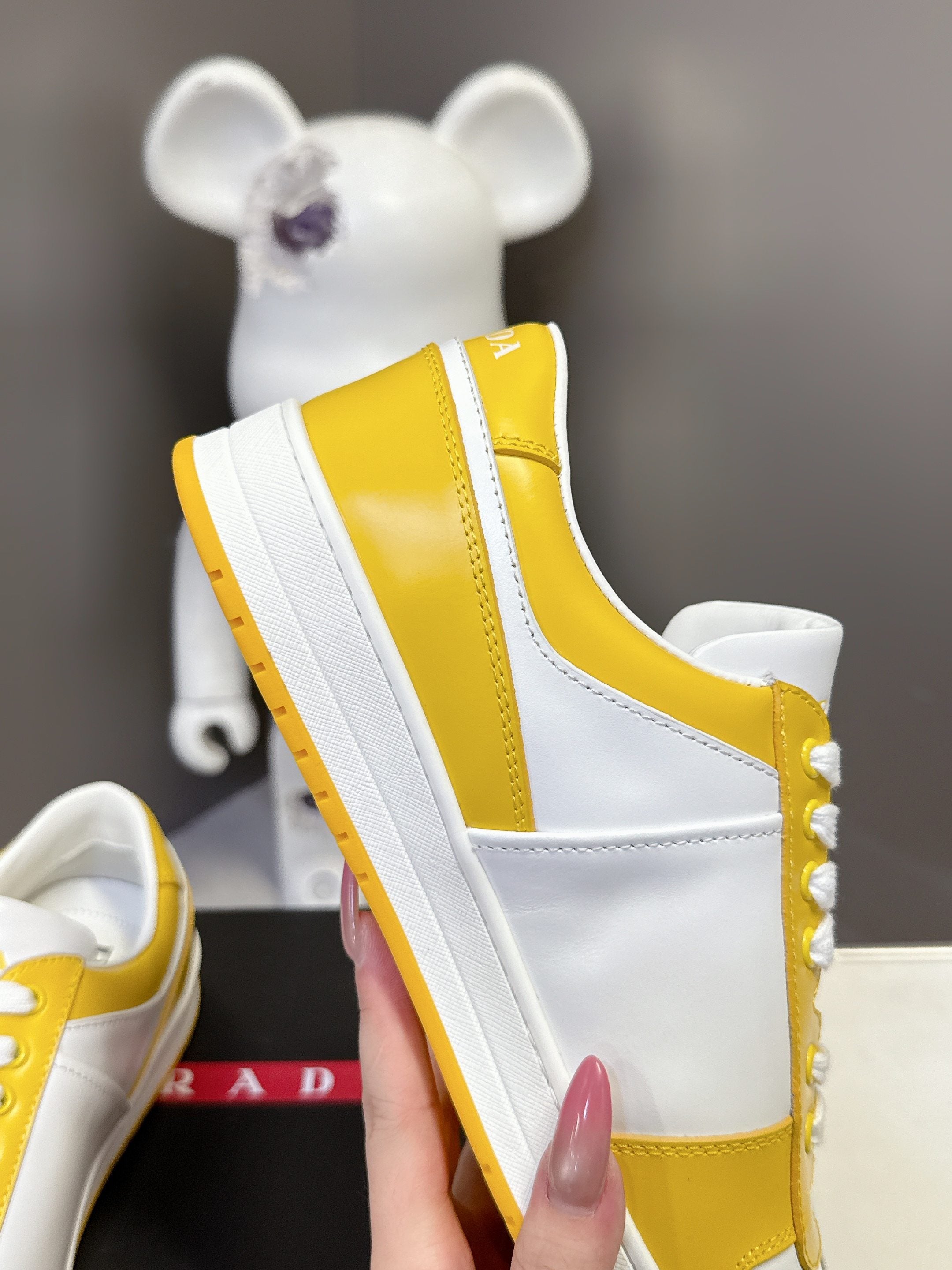 Prada unisex sneakers profile, white sidewall and yellow heel panel with thick sole