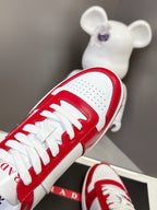 Red leather sneaker with white laces and perforated toe