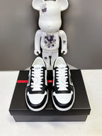 Prada unisex low-top sneakers, white laces with black toe caps on a box