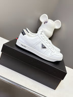 White Prada unisex low-top sneakers with lace-up front and side logo detail