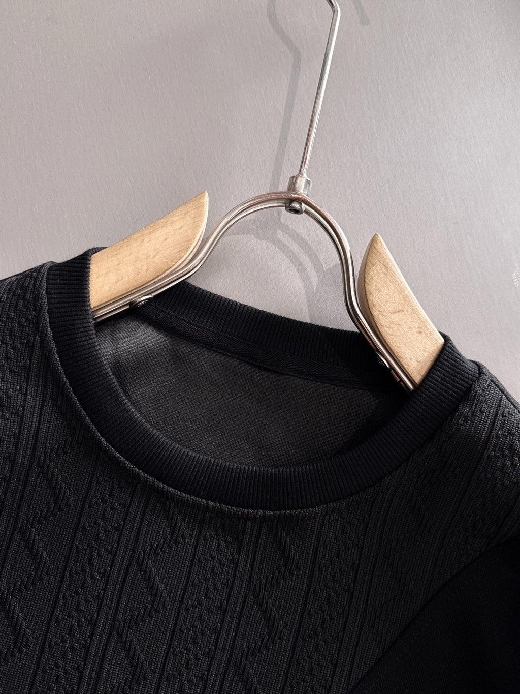 Fendi black long-sleeve crewneck sweatshirt close-up with ribbed collar