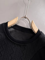 Fendi black long-sleeve crewneck sweatshirt close-up with ribbed collar