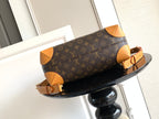 Louis Vuitton monogram handbag with tan leather shoulder strap and gold buckle details