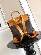 Louis Vuitton men's tote bag with detachable shoulder strap and tan buckle hardware