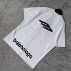 White Balenciaga short-sleeve T-shirt folded flat with large “balenciaga” logo