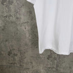 White Balenciaga T-shirt hanging view, short sleeves, crew neck hem visible