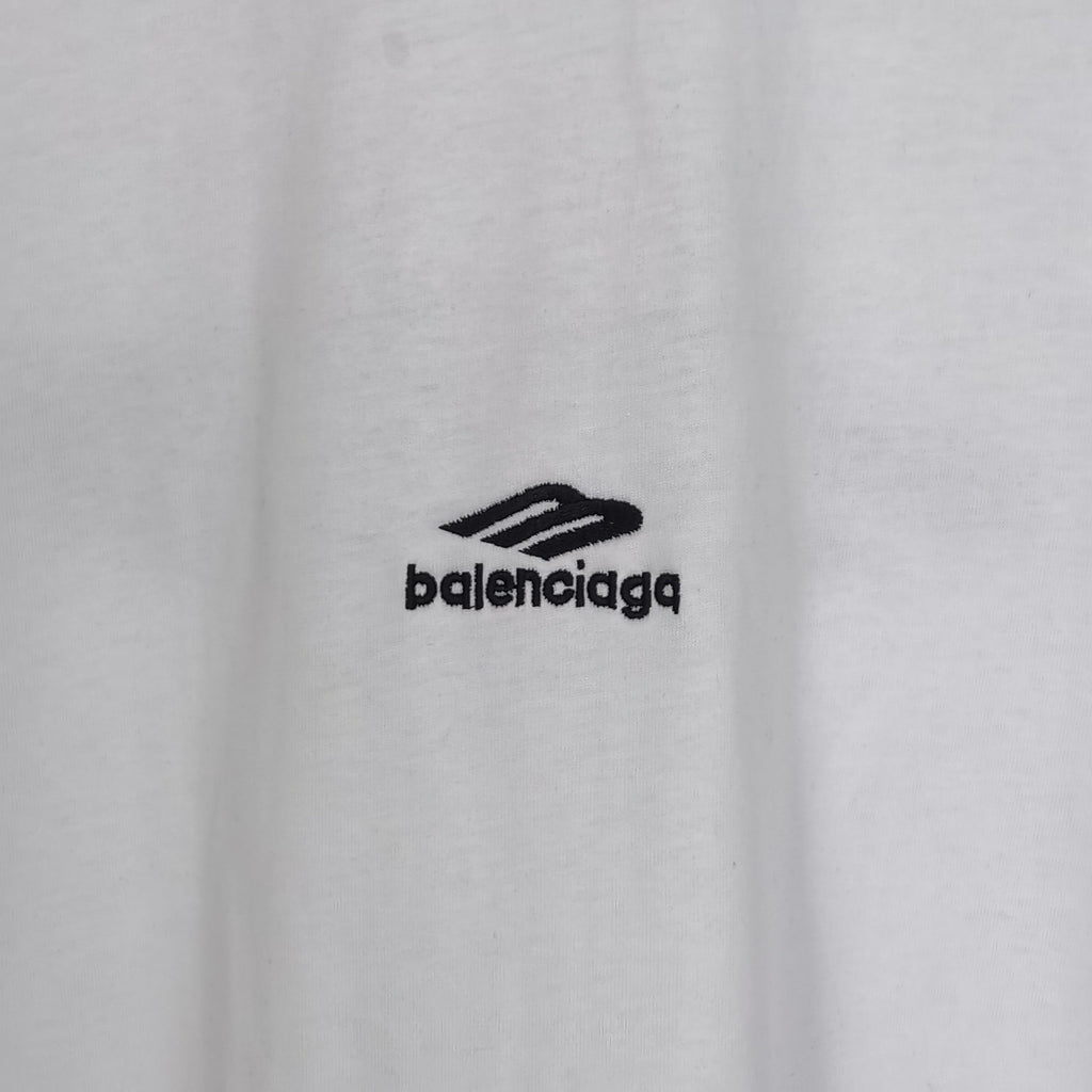 White Balenciaga T-shirt chest area with black “balenciaga” logo