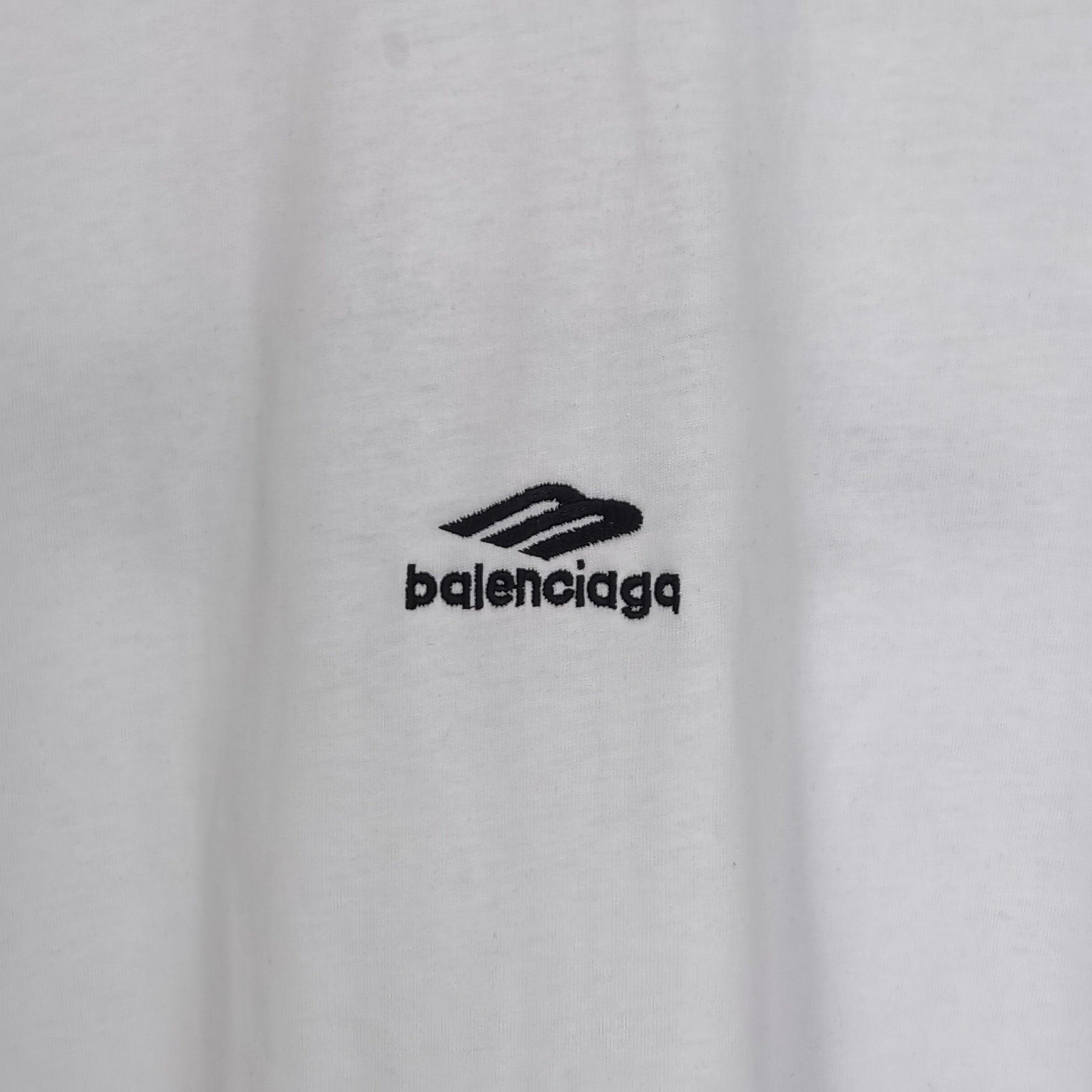 White Balenciaga T-shirt chest area with black “balenciaga” logo