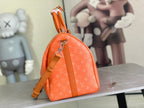 Orange monogram dome bag with short strap and leather top handle