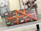 Men's Louis Vuitton duffel bag with brown check pattern, colorful animal and palm accents