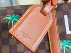 Louis Vuitton leather luggage tag with embossed logo, attached to tan leather strap