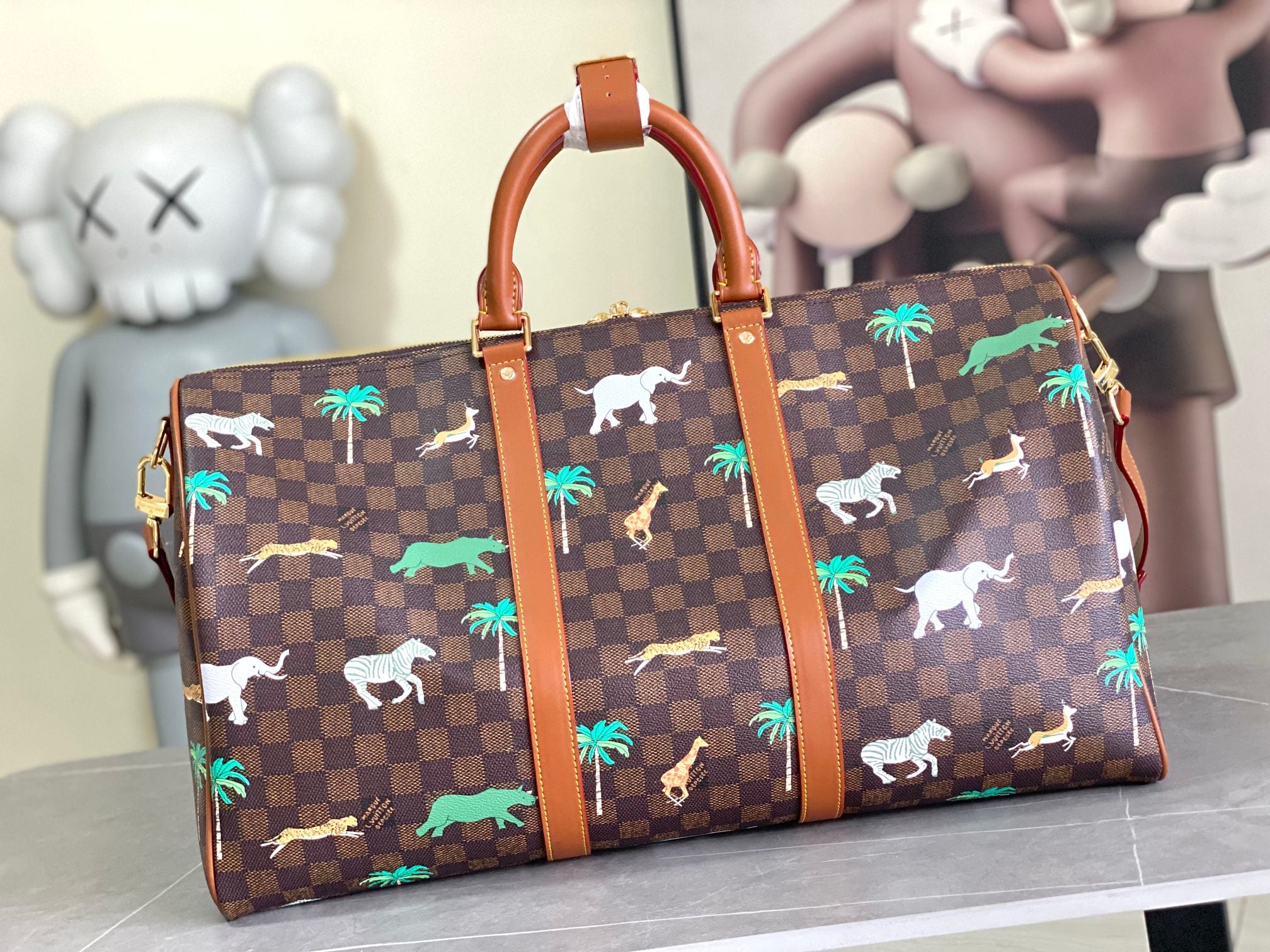 Louis Vuitton tote bag with brown check canvas and palm/animal motifs, structured top handles