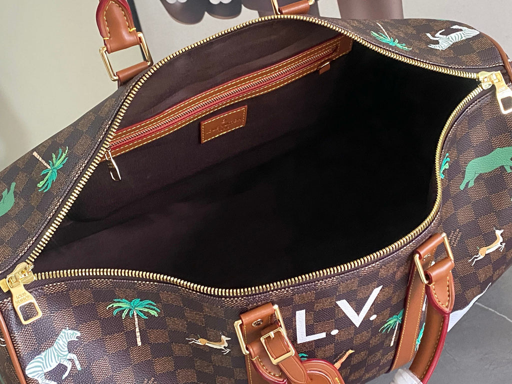 Open top handbag with brown check exterior, red leather trim, and dark lined interior