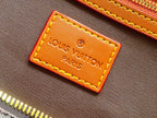 Louis Vuitton Paris leather label with gold stitching on brown monogram canvas