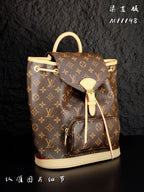 Louis Vuitton monogram canvas mini backpack with cream leather trim and front flap detail