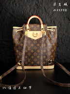 Louis Vuitton monogram canvas mini backpack front view with cream front pocket and shoulder strap
