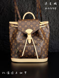 Louis Vuitton monogram canvas mini backpack with cream trim, top handle, and drawstring